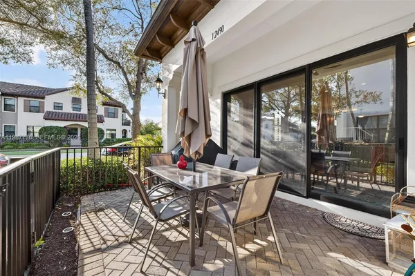 a view of outdoor dining space in the backyard