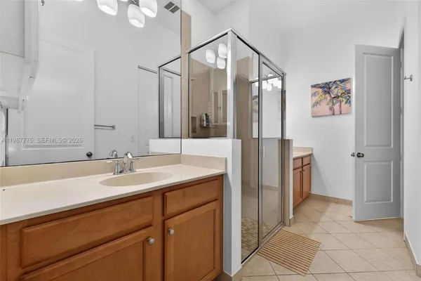 a bathroom with a shower and a sink