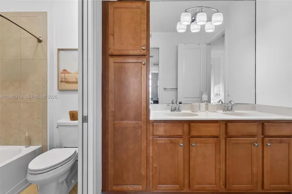 a bathroom with a toilet and a shower curtain