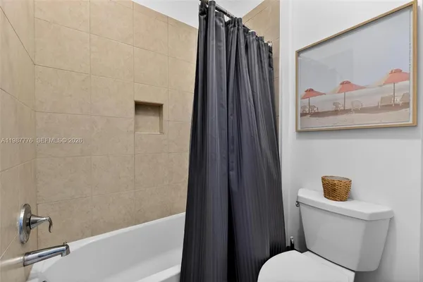 a bathroom with a sink a mirror and a shower