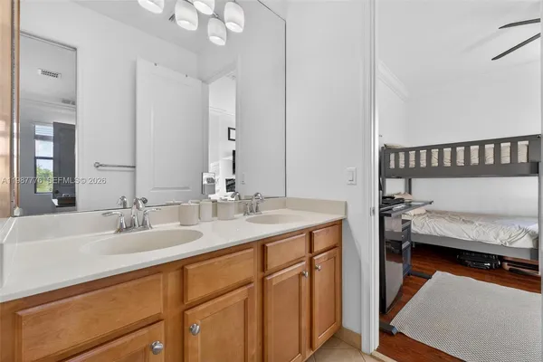 a bedroom with furniture and a flat screen tv