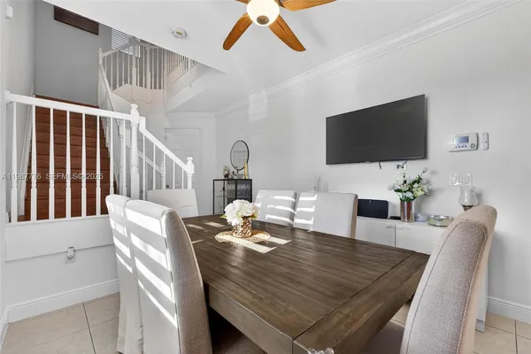 a dining room with furniture and window