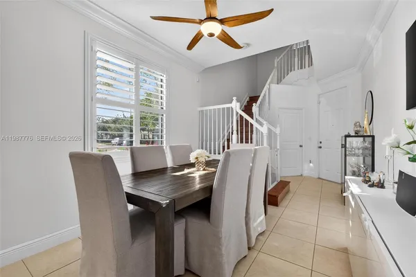 a kitchen with stainless steel appliances granite countertop a refrigerator a sink and a stove