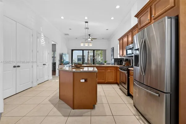 a kitchen with stainless steel appliances granite countertop a stove and a sink
