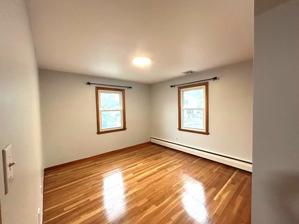 122 Running Brook Road Boston, MA 02132 - Photo 14 of 21 a view of an empty room and window