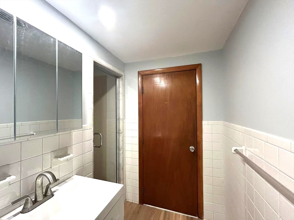 122 Running Brook Road Boston, MA 02132 - Photo 18 of 21 a bathroom with a sink and a mirror