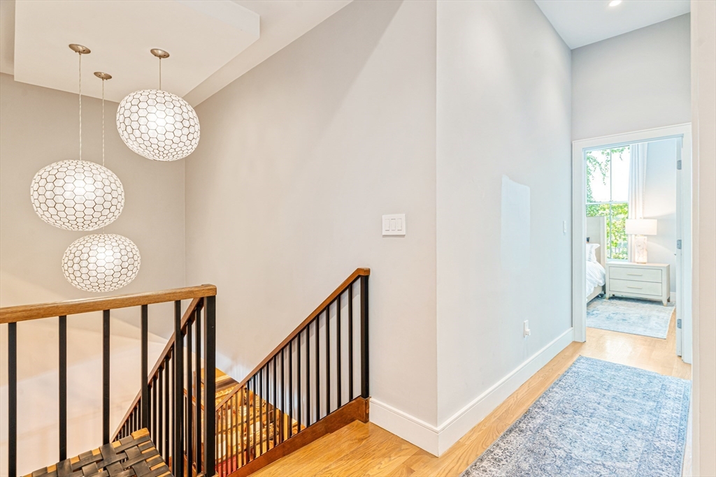 491 Massachusetts Avenue, Unit 1 Boston, MA 02118 - Photo 20 of 26 a view of a hallway with windows