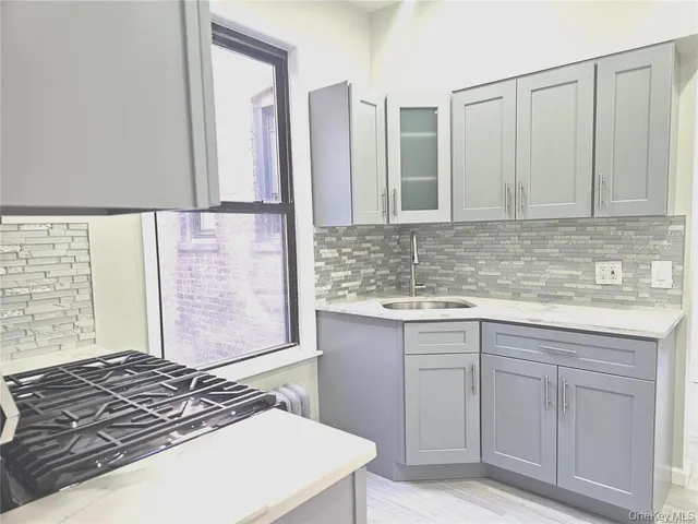 a kitchen with a refrigerator and a sink