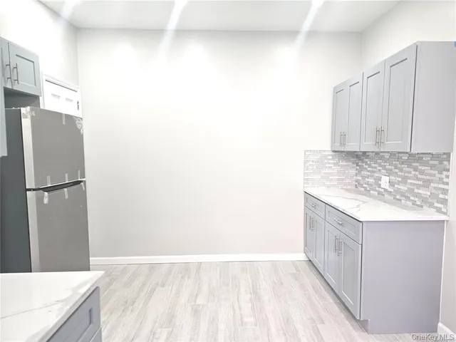 a view of hallway with wooden floor