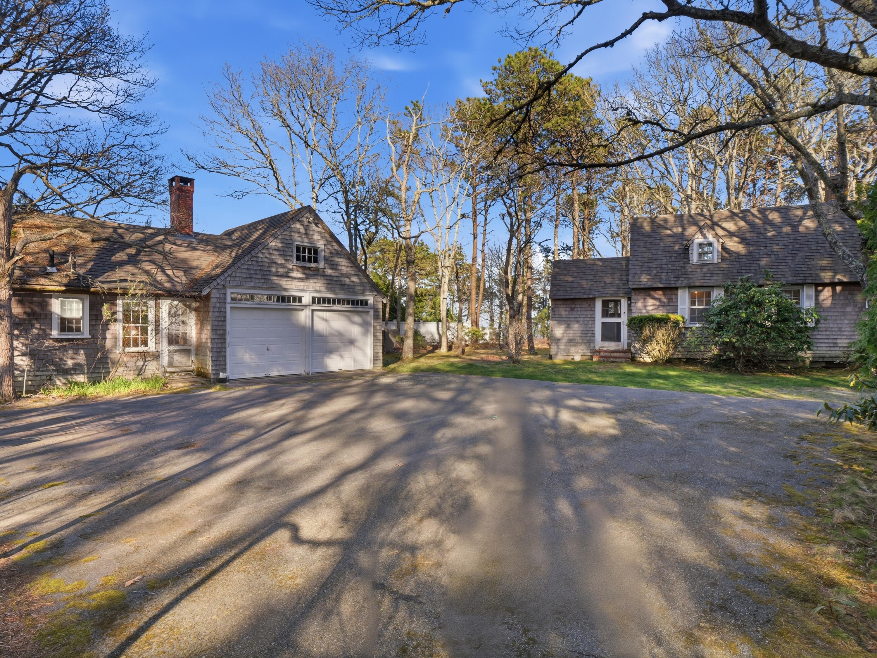 190 Vineyard Road Cotuit, MA 02635 - Photo 36 of 41 a front view of a house with a yard