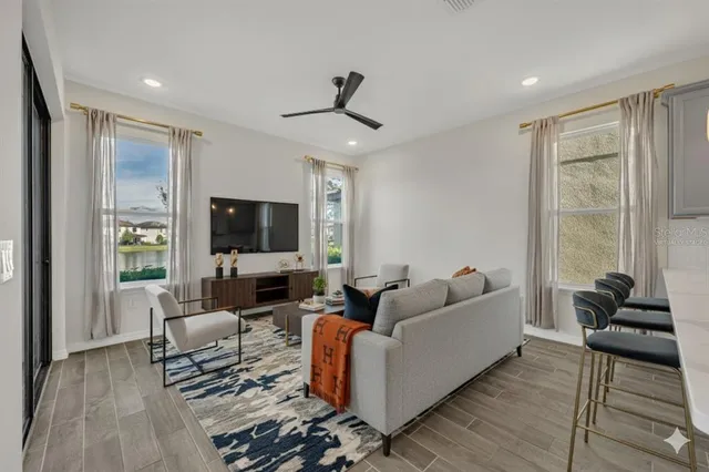 an aerial view of residential houses with outdoor space and ocean view
