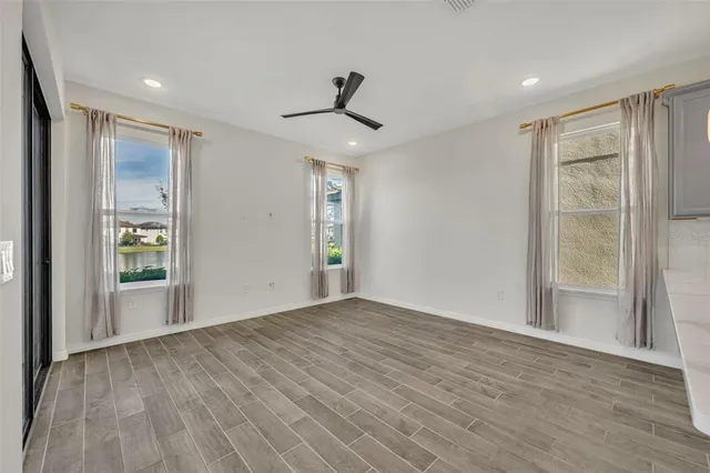 an aerial view of residential houses with outdoor space and swimming pool