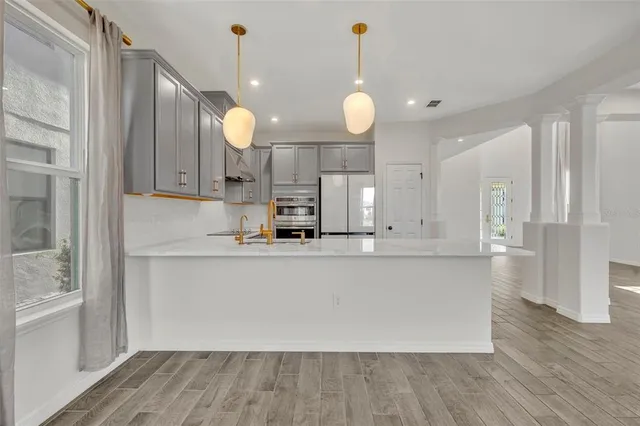 an aerial view of residential houses with outdoor space