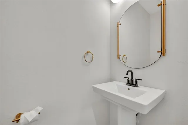 a view of a house with swimming pool and sitting area