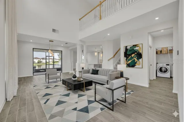 a view of a kitchen with wooden floor and a window