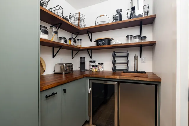 a kitchen with stainless steel appliances granite countertop a sink and cabinets