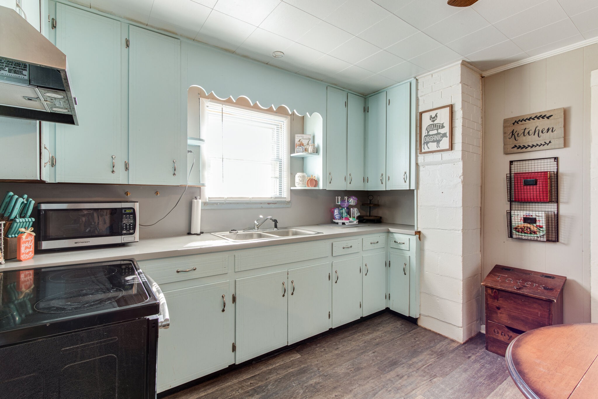 8026 Fredonia Road Manchester, TN 37355 - Photo 12 of 26 a kitchen with stainless steel appliances granite countertop a stove a sink and a microwave