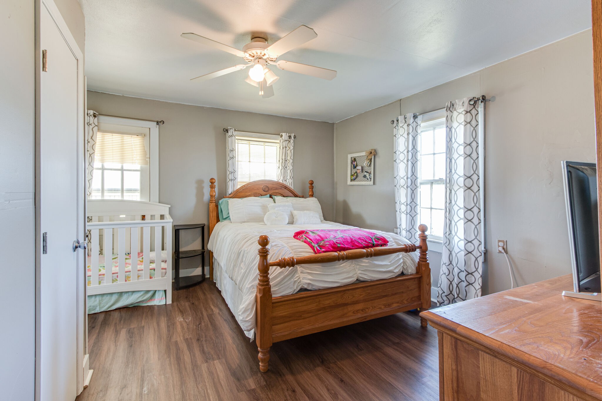 8026 Fredonia Road Manchester, TN 37355 - Photo 15 of 26 a bedroom with a bed and a chandelier