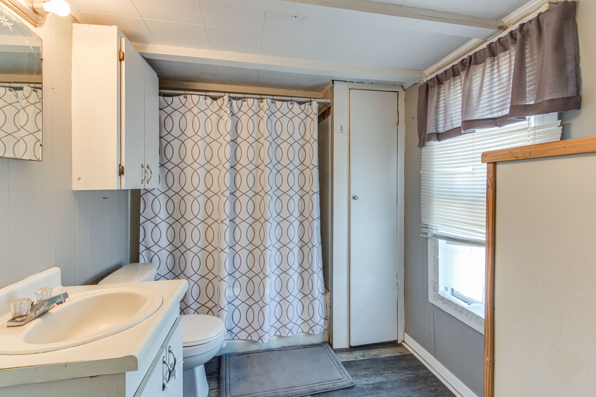 8026 Fredonia Road Manchester, TN 37355 - Photo 19 of 26 a bathroom with a sink and a mirror