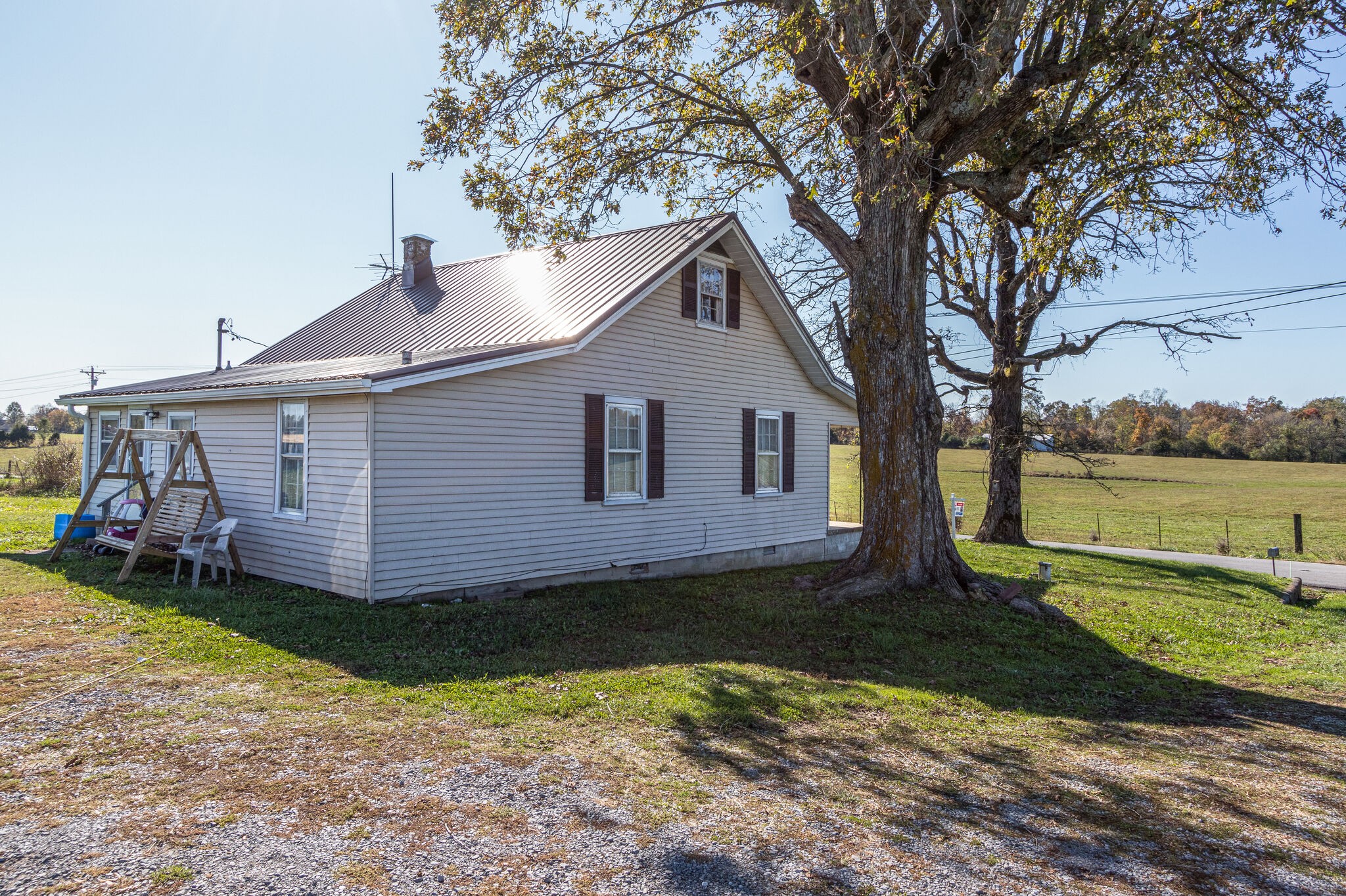 8026 Fredonia Road Manchester, TN 37355 - Photo 5 of 26 a view of a house with a yard and a large tree