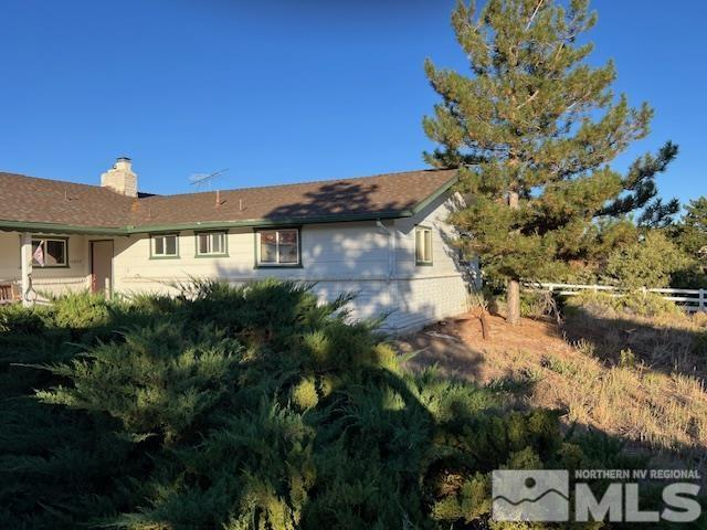 10835 Silver Knolls Boulevard Reno, NV 89508 - Photo 2 of 7 a view of a house with a yard