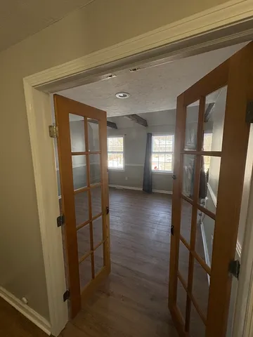 a view of entryway with stairs and wooden floor