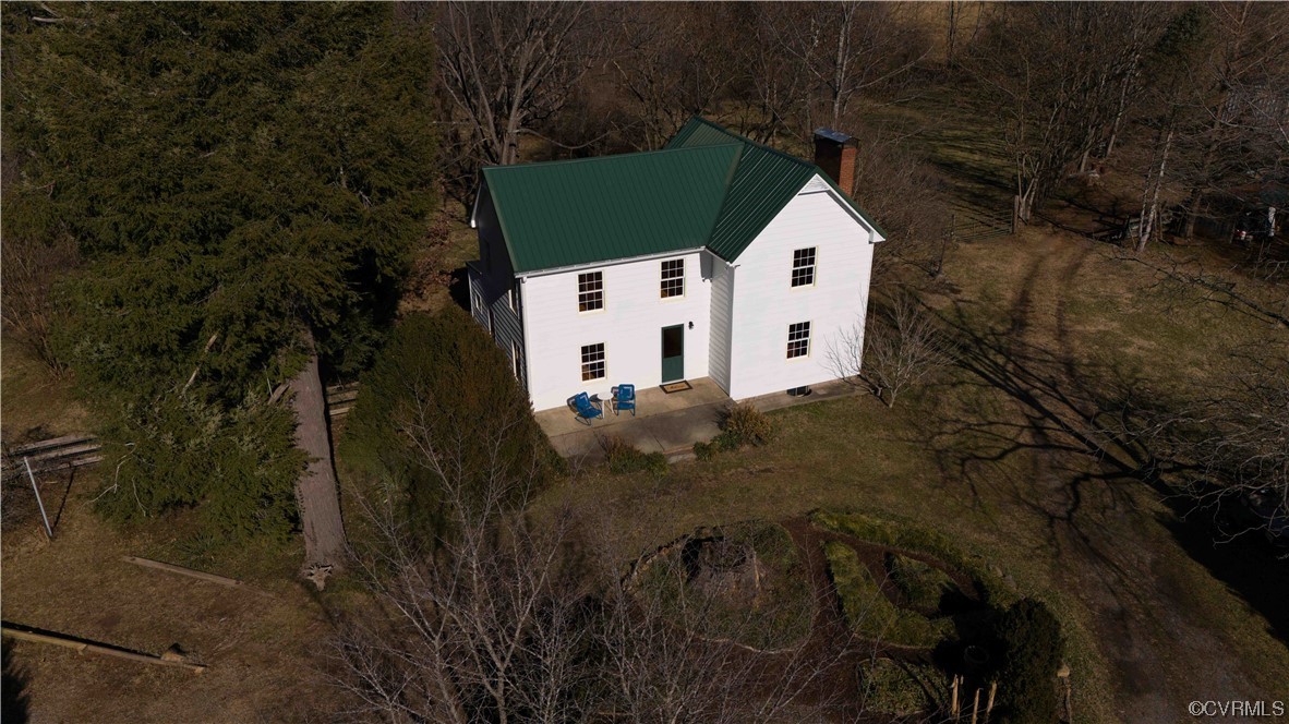 1431 Three Chopt Road Kents Store, VA 23084 - Photo 2 of 40 a white house with a white door in front of it