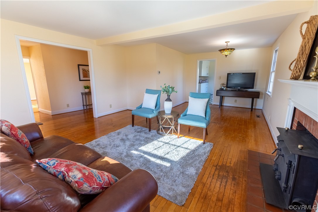 1431 Three Chopt Road Kents Store, VA 23084 - Photo 6 of 40 a living room with furniture and a wooden floor