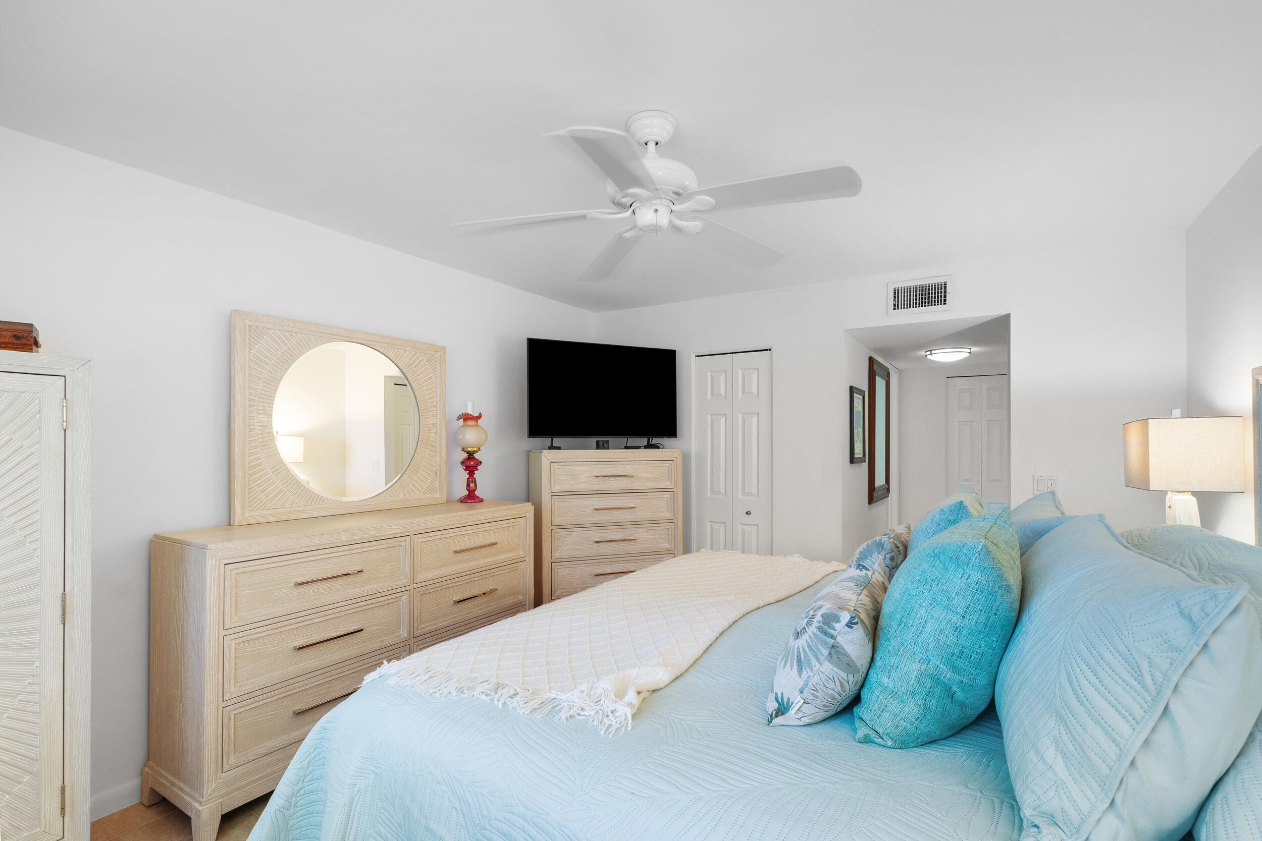 7 Colonial Club Drive, Unit 300 Boynton Beach, FL 33435 - Photo 13 of 24 a bedroom with a large bed and a flat tv screen on dresser