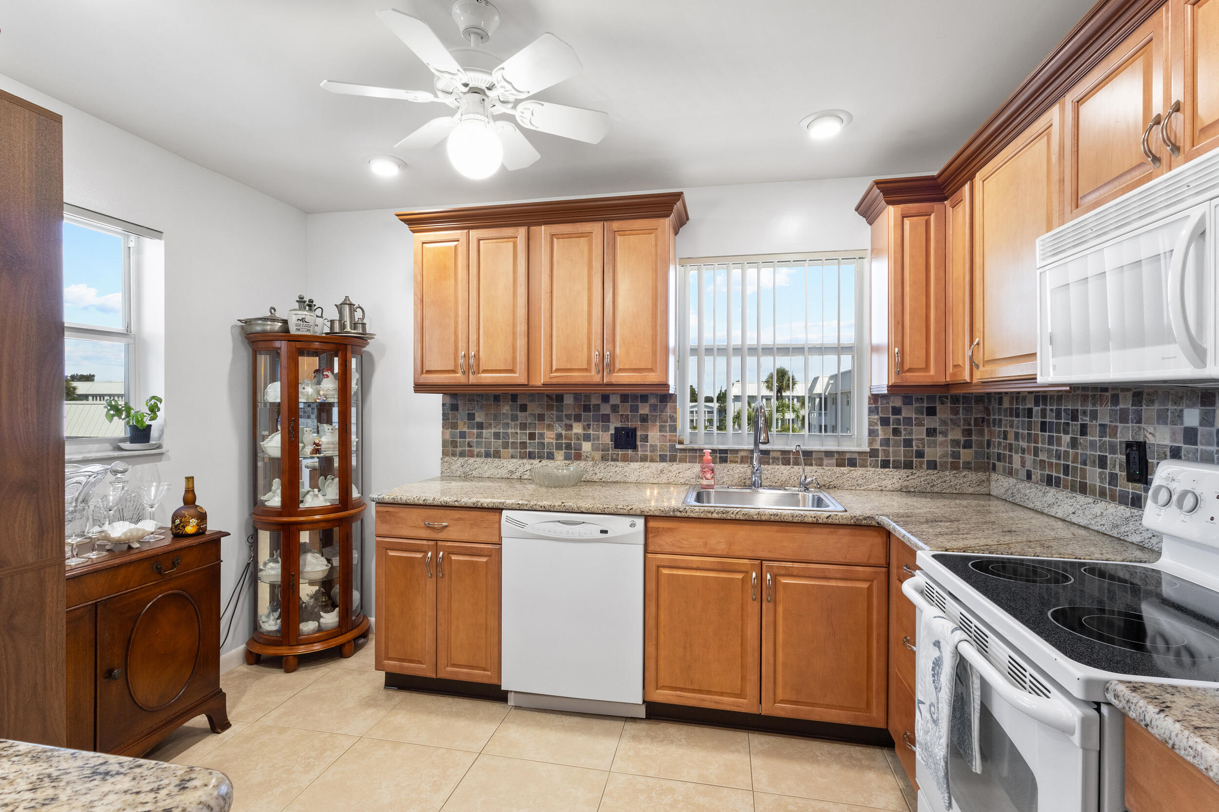 7 Colonial Club Drive, Unit 300 Boynton Beach, FL 33435 - Photo 2 of 24 a kitchen with a sink stove and refrigerator