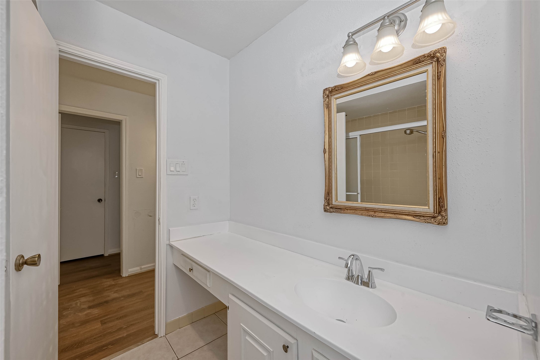 14179 Misty Meadow Lane Houston, TX 77079 - Photo 35 of 41 a bathroom with a sink and a mirror