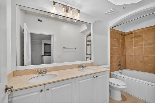 a view of a livingroom with a ceiling fan and window