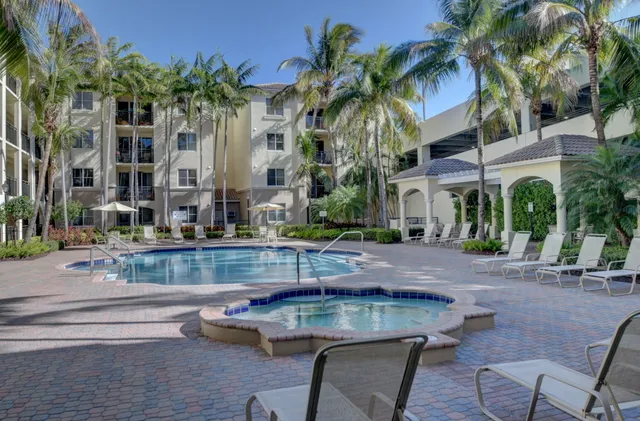 a view of a room with furniture and a chandelier
