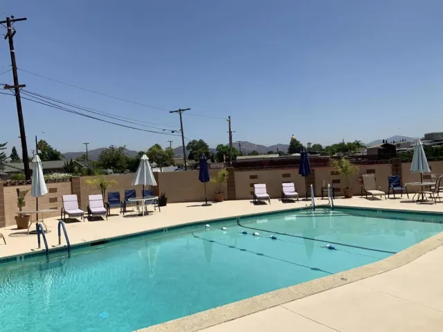 a view of a patio with a table and chairs