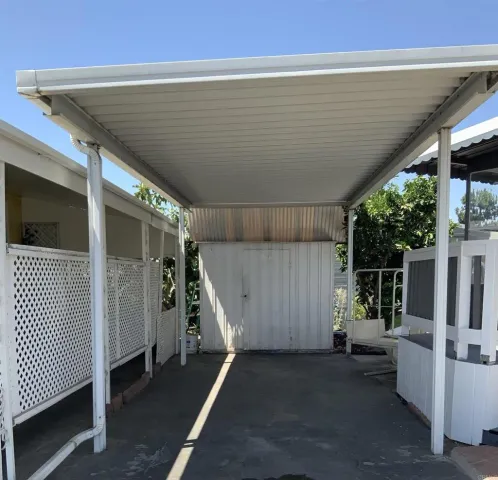 a view of hallway with wooden floor and windows