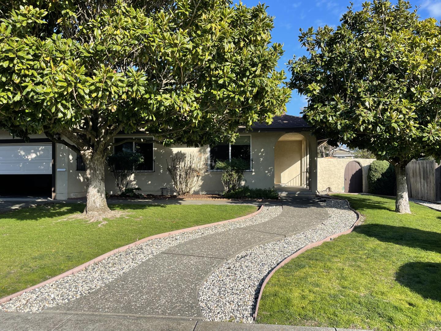 5732 Davis Circle Rohnert Park, CA 94928 - Photo 14 of 14 a front view of a house with a garden and trees