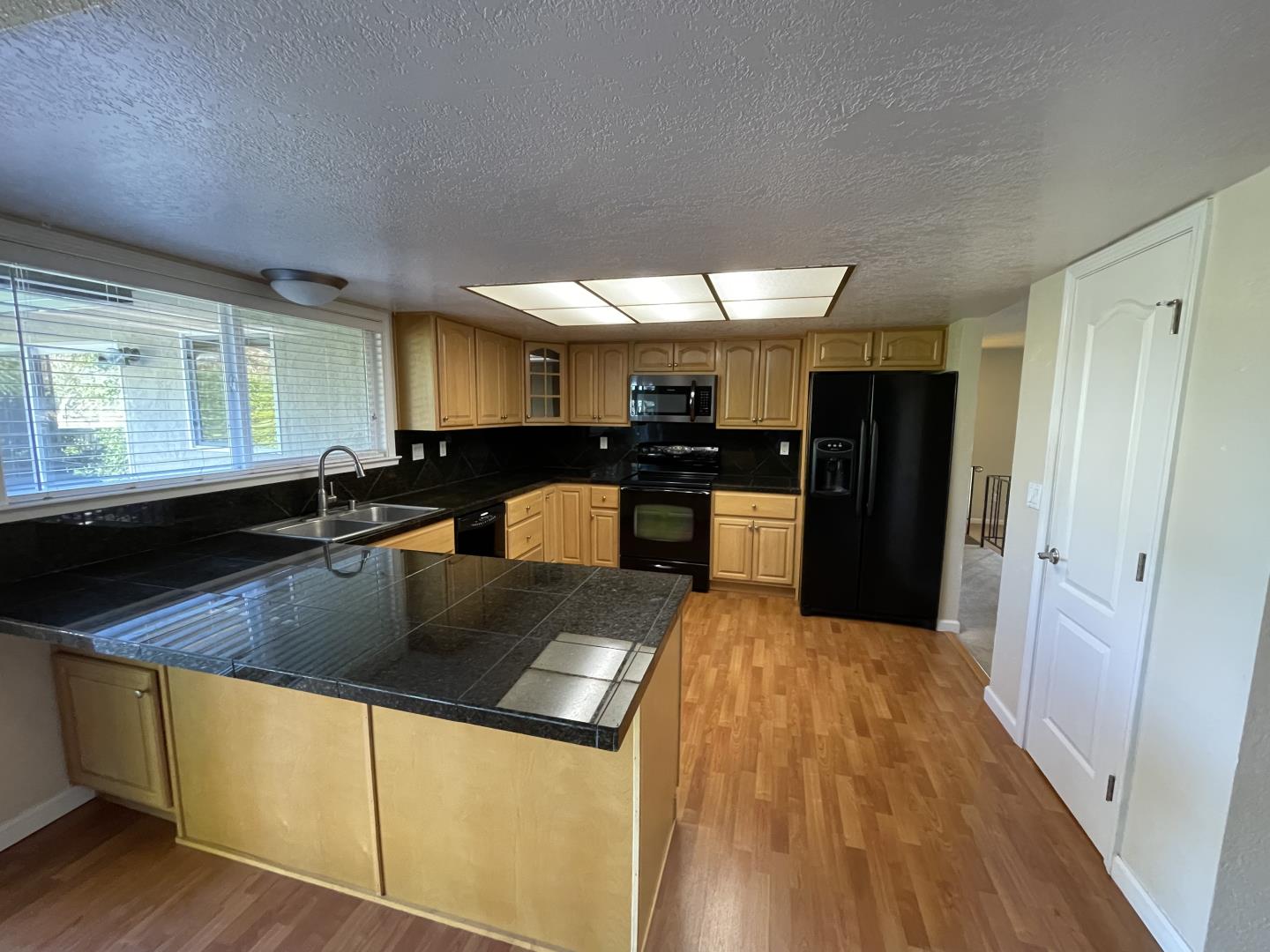 5732 Davis Circle Rohnert Park, CA 94928 - Photo 4 of 14 a kitchen with stainless steel appliances granite countertop a sink a stove and a refrigerator