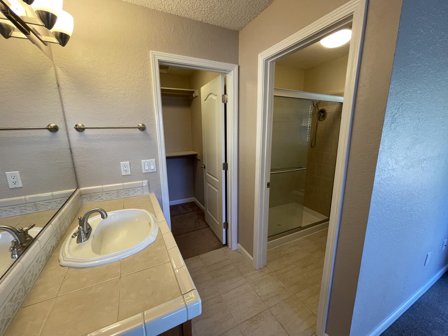 5732 Davis Circle Rohnert Park, CA 94928 - Photo 9 of 14 a bathroom with a granite countertop sink and a tub