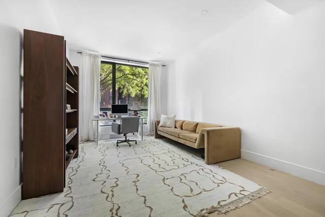 a living room with furniture window and a table
