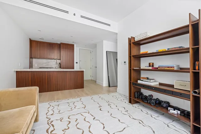 a room with a bed and a cabinets