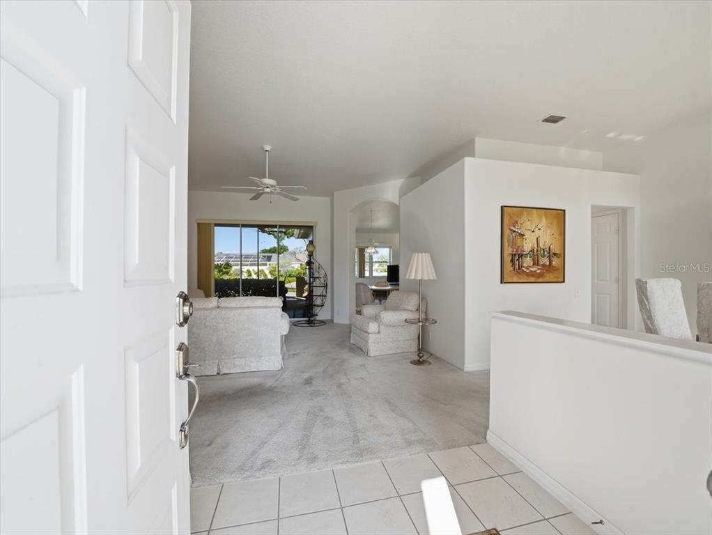 9311 Butler Boulevard Weeki Wachee, FL 34613 - Photo 19 of 60 a view of a hallway with bathroom and a shower