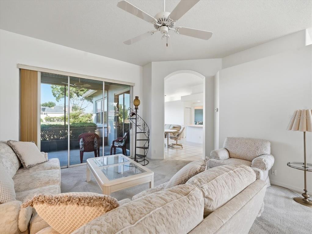 9311 Butler Boulevard Weeki Wachee, FL 34613 - Photo 22 of 60 a living room with furniture and a large window