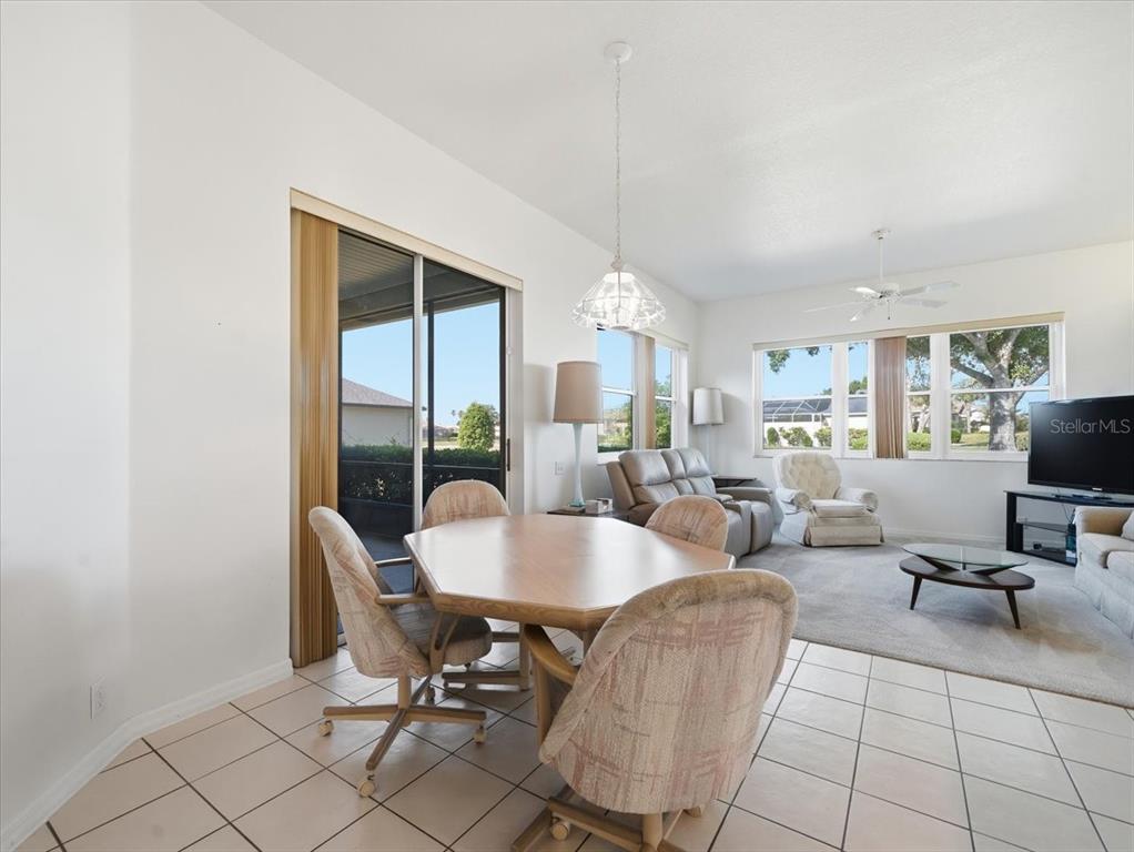9311 Butler Boulevard Weeki Wachee, FL 34613 - Photo 29 of 60 a view of a dining room with furniture window and outside view
