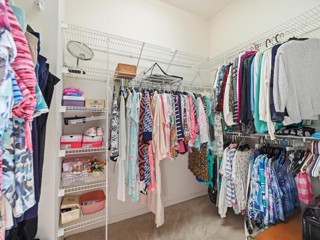 9311 Butler Boulevard Weeki Wachee, FL 34613 - Photo 49 of 60 a view of walk in closet with clothes