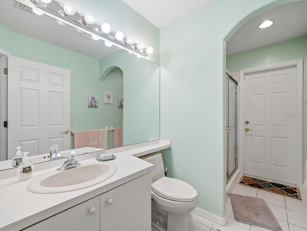 9311 Butler Boulevard Weeki Wachee, FL 34613 - Photo 52 of 60 a bathroom with a sink and a mirror