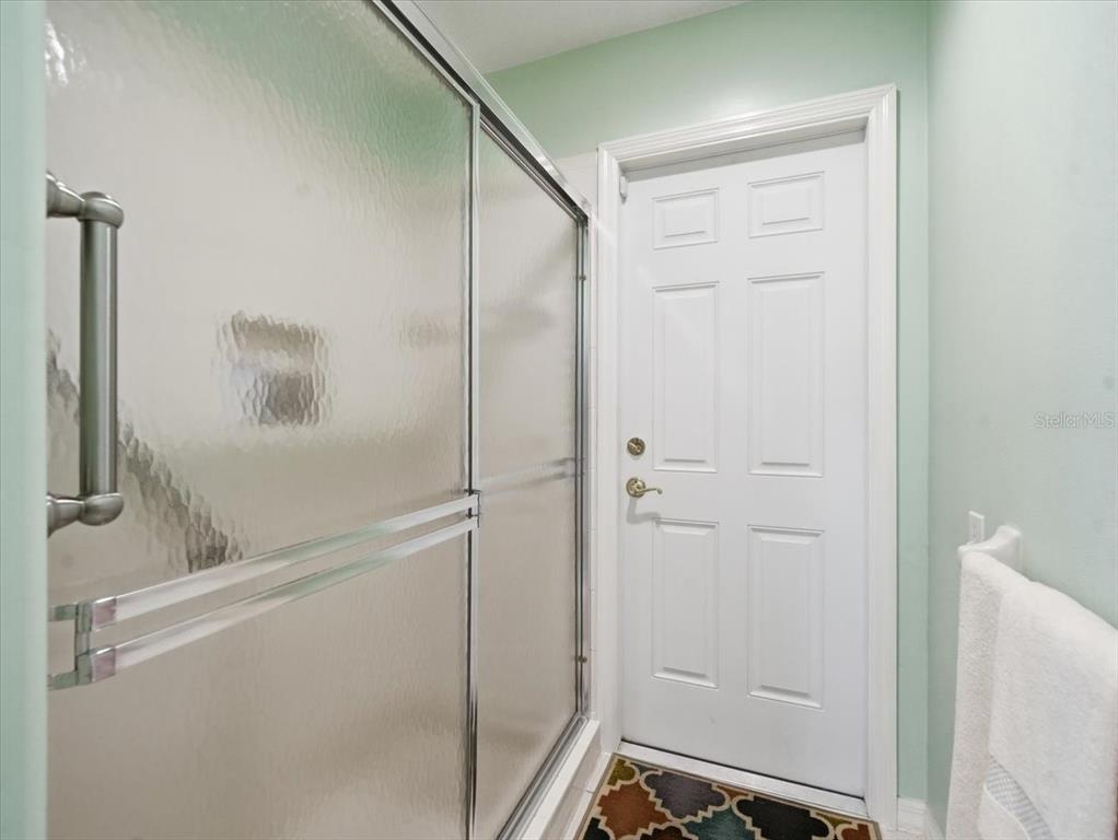 9311 Butler Boulevard Weeki Wachee, FL 34613 - Photo 53 of 60 a bathroom with a shower