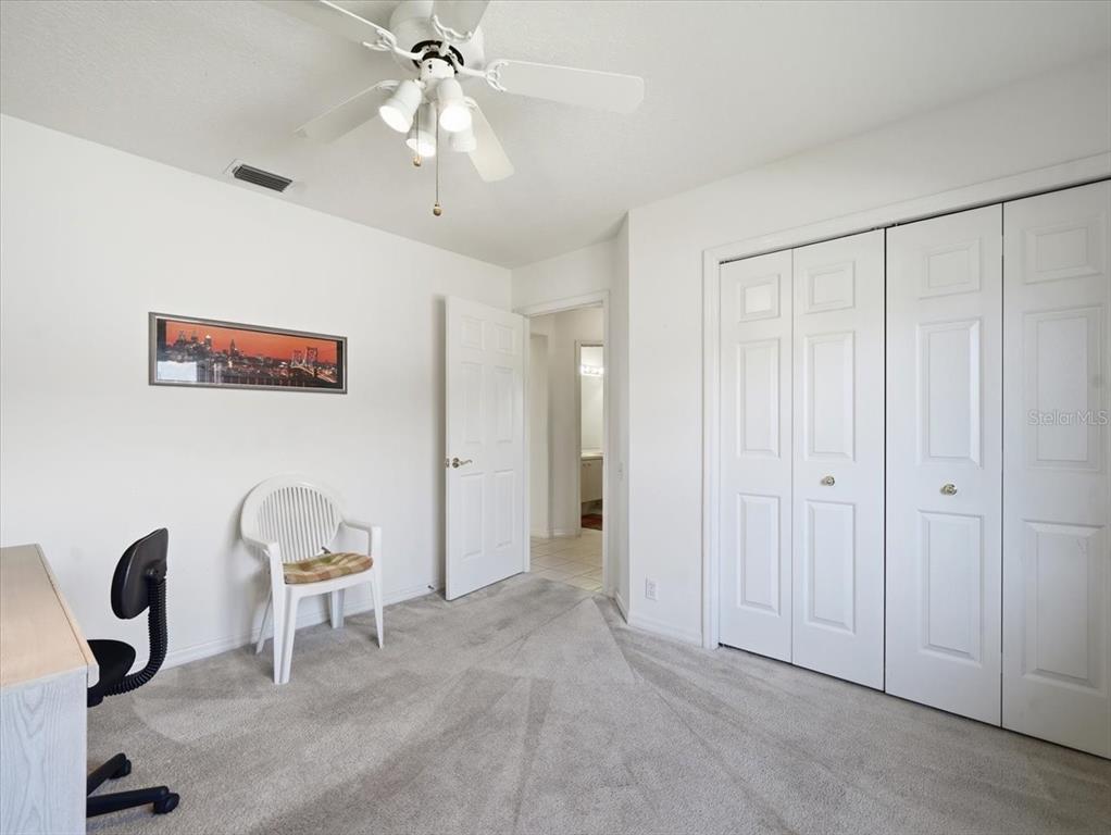 9311 Butler Boulevard Weeki Wachee, FL 34613 - Photo 55 of 60 a view of a workspace with furniture and a window
