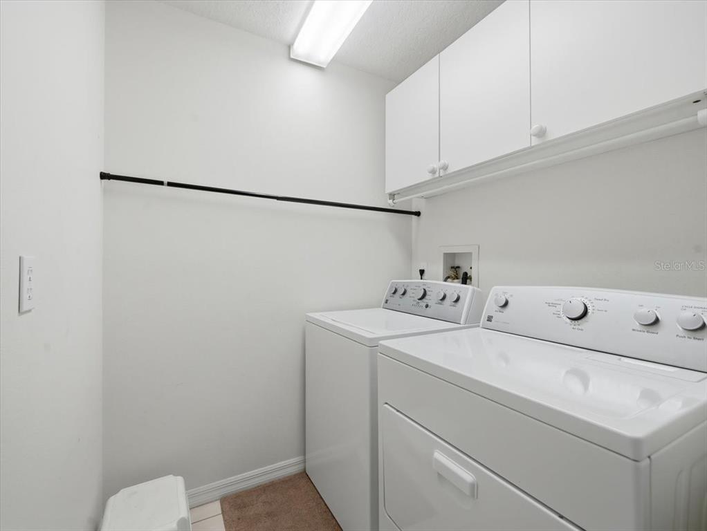 9311 Butler Boulevard Weeki Wachee, FL 34613 - Photo 56 of 60 a utility room with dryer and washer