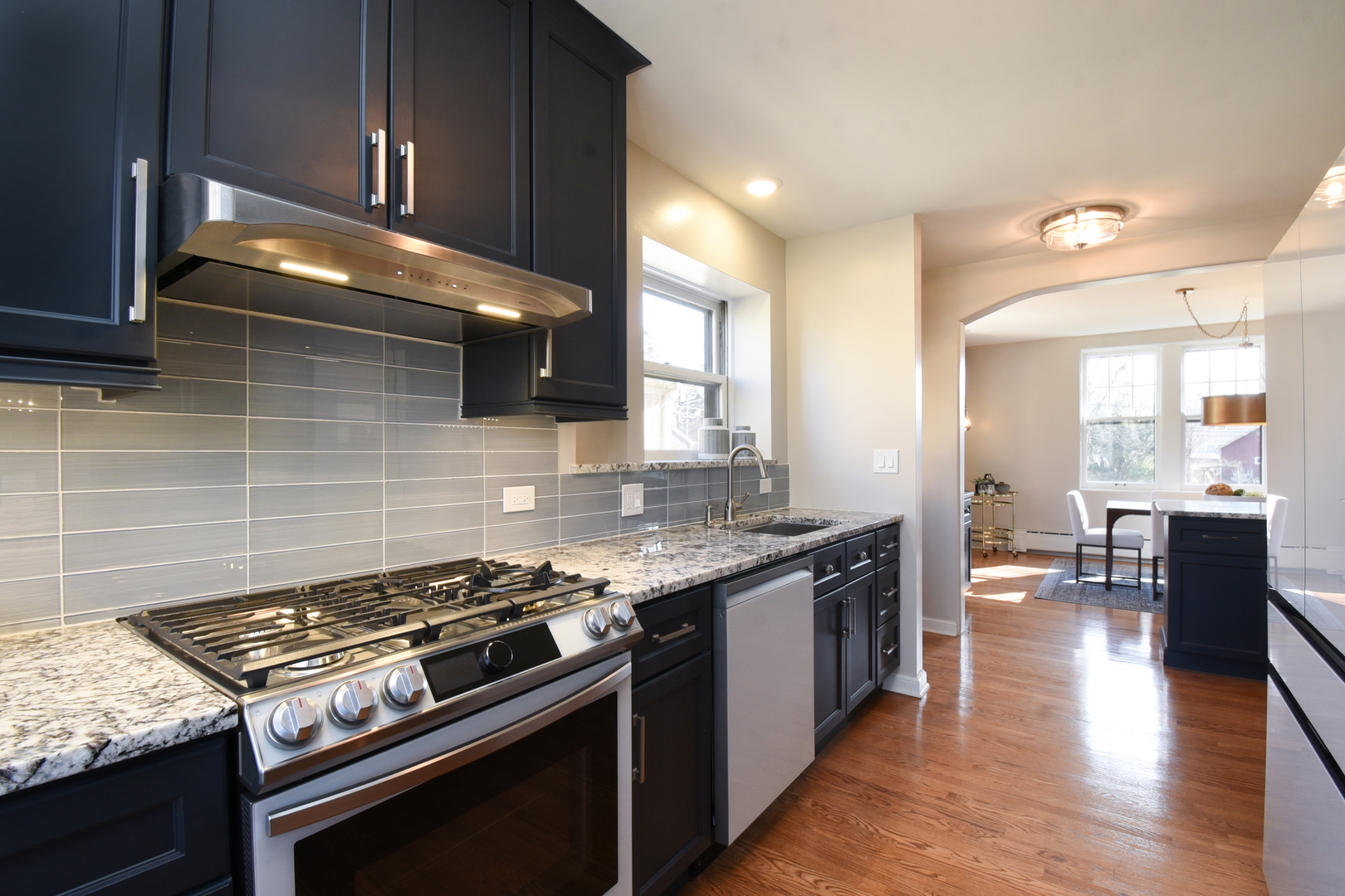 427 Uvedale Road Riverside, IL 60546 - Photo 11 of 33 a kitchen with a stove and wooden floor