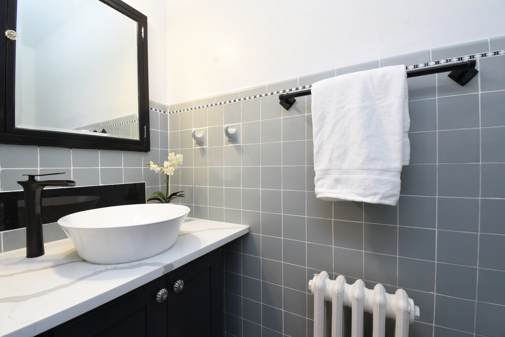 427 Uvedale Road Riverside, IL 60546 - Photo 12 of 33 a bathroom with a sink and a mirror